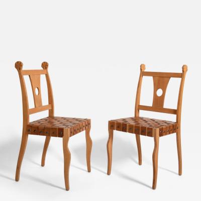 Pair of Etruscan oak and leather chairs 1970s 