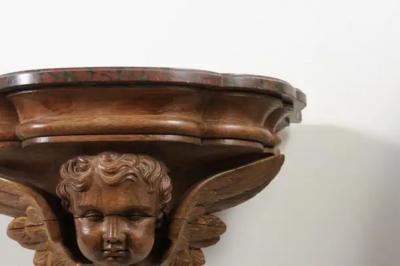 Pair of French 1880s Carved Walnut Brackets with Cherubs and Faux Marble Tops