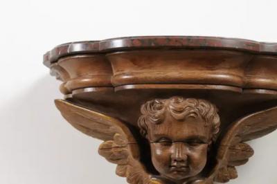 Pair of French 1880s Carved Walnut Brackets with Cherubs and Faux Marble Tops