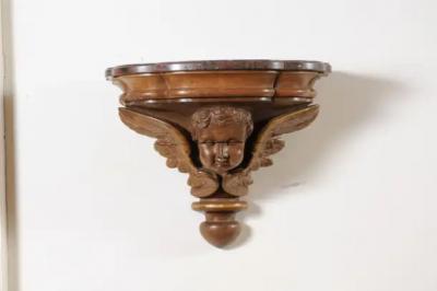 Pair of French 1880s Carved Walnut Brackets with Cherubs and Faux Marble Tops