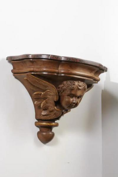 Pair of French 1880s Carved Walnut Brackets with Cherubs and Faux Marble Tops