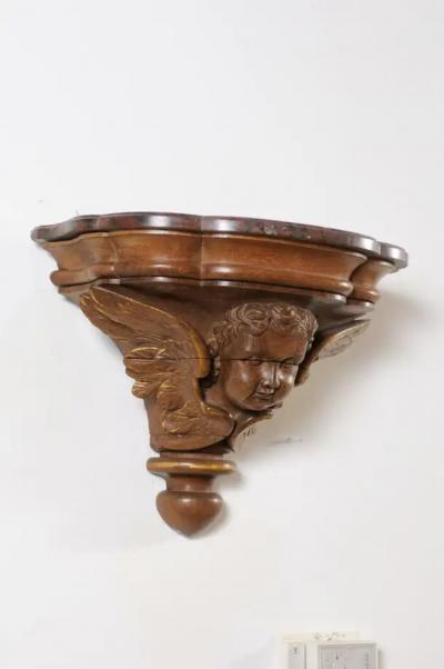 Pair of French 1880s Carved Walnut Brackets with Cherubs and Faux Marble Tops