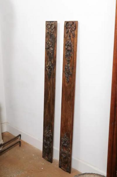 Pair of French 1890s Carved Wooden Panels with Ribbon Tied Bouquets and Urns