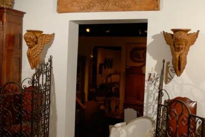 Pair of French 19th Century Wooden Wall Brackets with Carved Cherubs