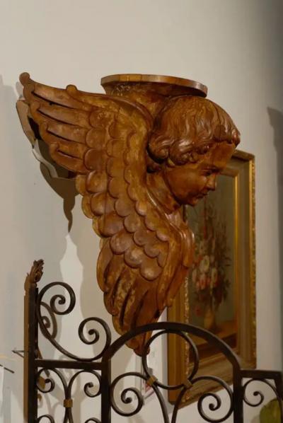 Pair of French 19th Century Wooden Wall Brackets with Carved Cherubs