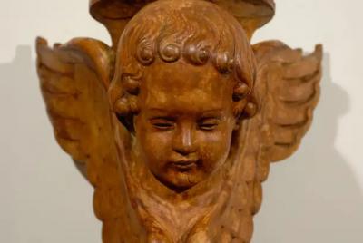 Pair of French 19th Century Wooden Wall Brackets with Carved Cherubs