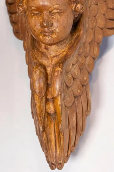Pair of French 19th Century Wooden Wall Brackets with Carved Cherubs