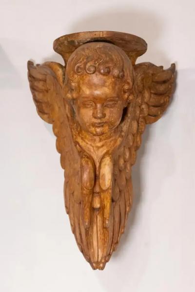 Pair of French 19th Century Wooden Wall Brackets with Carved Cherubs