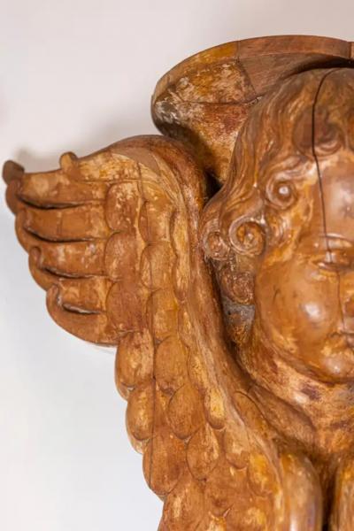 Pair of French 19th Century Wooden Wall Brackets with Carved Cherubs