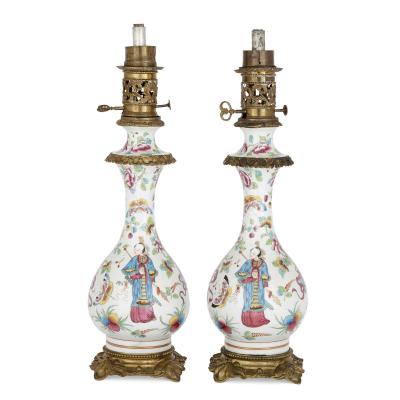 Pair of French Chinoiserie style gilt bronze mounted porcelain oil lamps