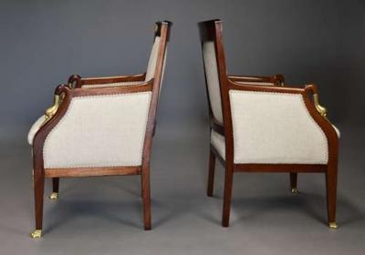 Pair of French Empire style mahogany upholstered armchairs