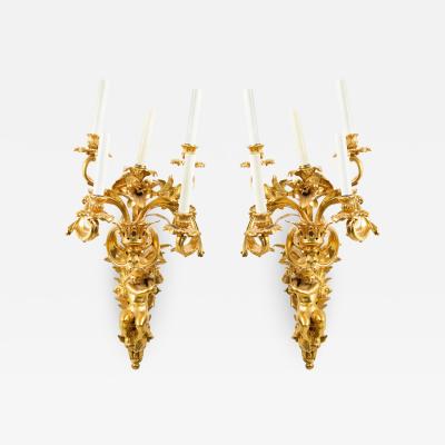 Pair of French Louis XV Style Bronze Dore Cupid Wall Sconces