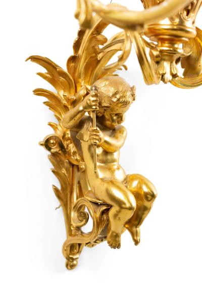Pair of French Louis XV Style Bronze Dore Cupid Wall Sconces