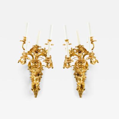 Pair of French Louis XV Style Bronze Dore Cupid Wall Sconces