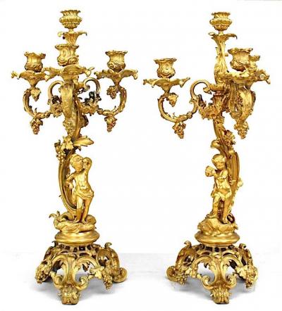 Pair of French Louis XV Style Bronze Dore Four Arm Cupid Candelabras