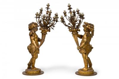 Pair of French Louis XV Style Gilt Cherub Torchieres