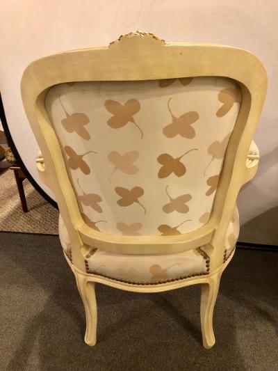 Pair of French Louis XV Style Parcel Gilt and Paint Decorated Bergere Chairs