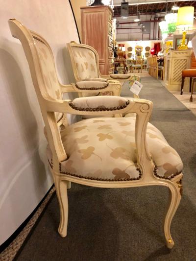 Pair of French Louis XV Style Parcel Gilt and Paint Decorated Bergere Chairs