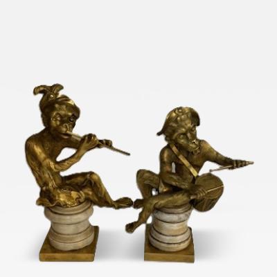 Pair of French Louis XV style gilt bronze monkeys playing musical instruments o