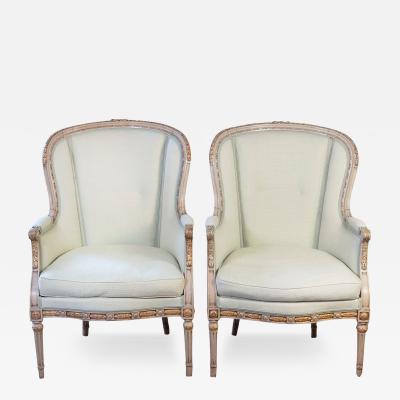 Pair of French Louis XVI Style 1900s Painted and Parcel Gilt Berg res Chairs