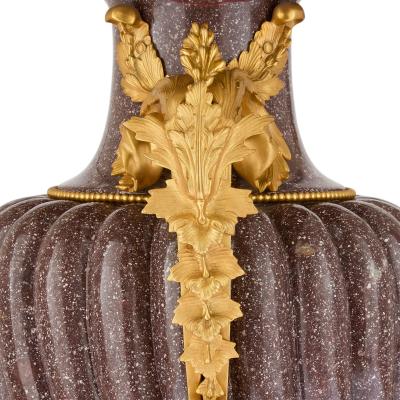 Pair of French Neoclassical style ormolu mounted porphyry vases