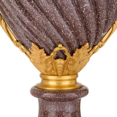 Pair of French Neoclassical style ormolu mounted porphyry vases