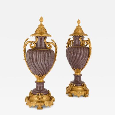 Pair of French Neoclassical style ormolu mounted porphyry vases