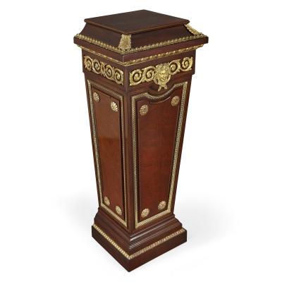 Pair of French Neoclassical style parcel gilt mahogany pedestals