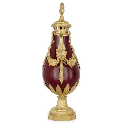 Pair of French Neoclassical style red t le and gilt bronze vases