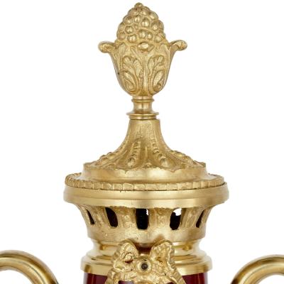 Pair of French Neoclassical style red t le and gilt bronze vases