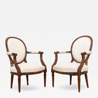 Pair of French Oak Louis XVI Style Fauteuils