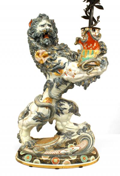 Pair of French Porcelain Lions Holding Wrought Iron Candelabras