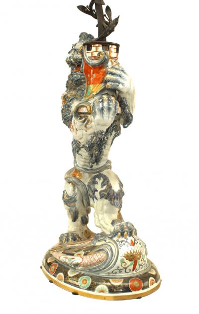 Pair of French Porcelain Lions Holding Wrought Iron Candelabras