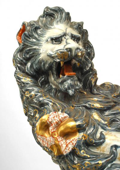 Pair of French Porcelain Lions Holding Wrought Iron Candelabras