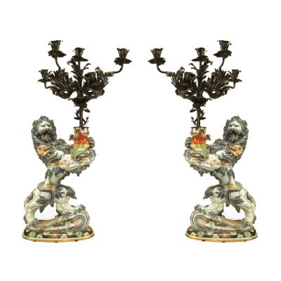 Pair of French Porcelain Lions Holding Wrought Iron Candelabras