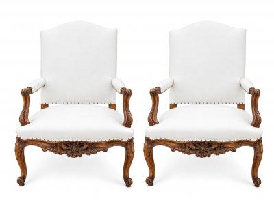 Pair of French Regence Style Armchairs in carved Walnut 19th Century