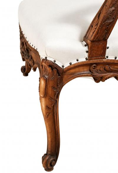 Pair of French Regence Style Armchairs in carved Walnut 19th Century