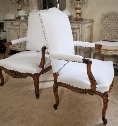 Pair of French Regence Style Armchairs in carved Walnut 19th Century
