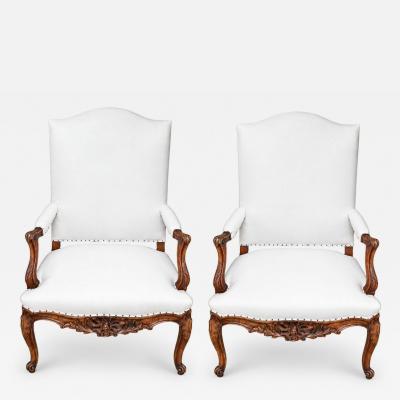 Pair of French Regence Style Armchairs in carved Walnut 19th Century