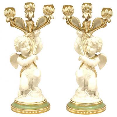 Pair of French Victorian White and Gilt Porcelain Cupid Candelabras