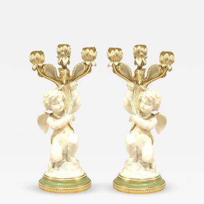 Pair of French Victorian White and Gilt Porcelain Cupid Candelabras