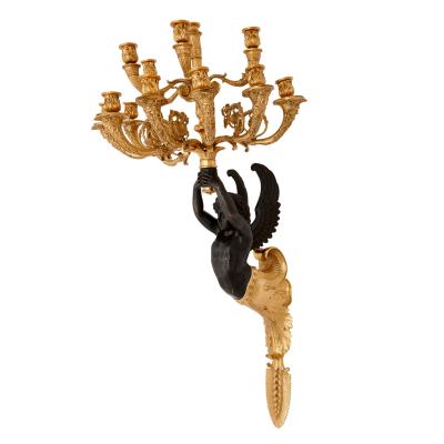 Pair of French gilt and patinated bronze wall lights