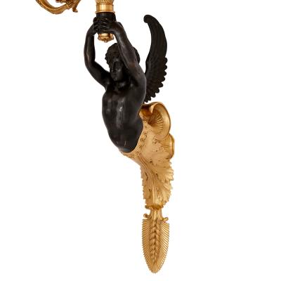 Pair of French gilt and patinated bronze wall lights