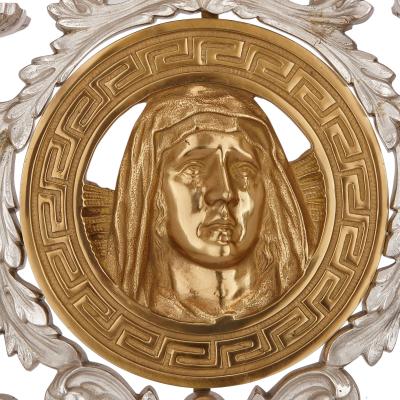 Pair of French gilt and silvered bronze candelabra depicting Jesus and Madonna