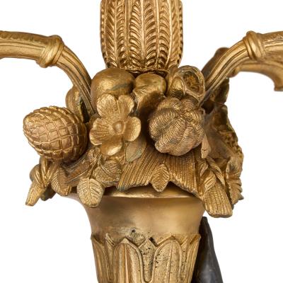 Pair of French gilt bronze and patinated bronze candelabra