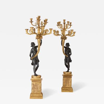 Pair of French gilt bronze and patinated bronze candelabra