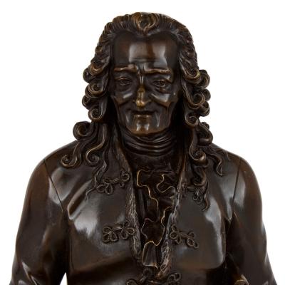 Pair of French patinated bronze sculptures of Voltaire and Rousseau