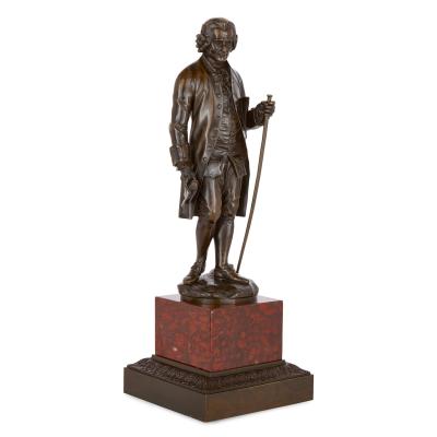 Pair of French patinated bronze sculptures of Voltaire and Rousseau