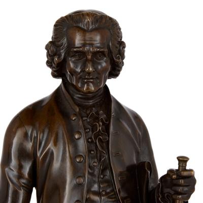 Pair of French patinated bronze sculptures of Voltaire and Rousseau