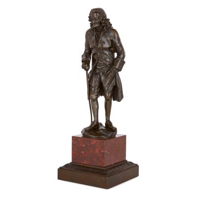 Pair of French patinated bronze sculptures of Voltaire and Rousseau